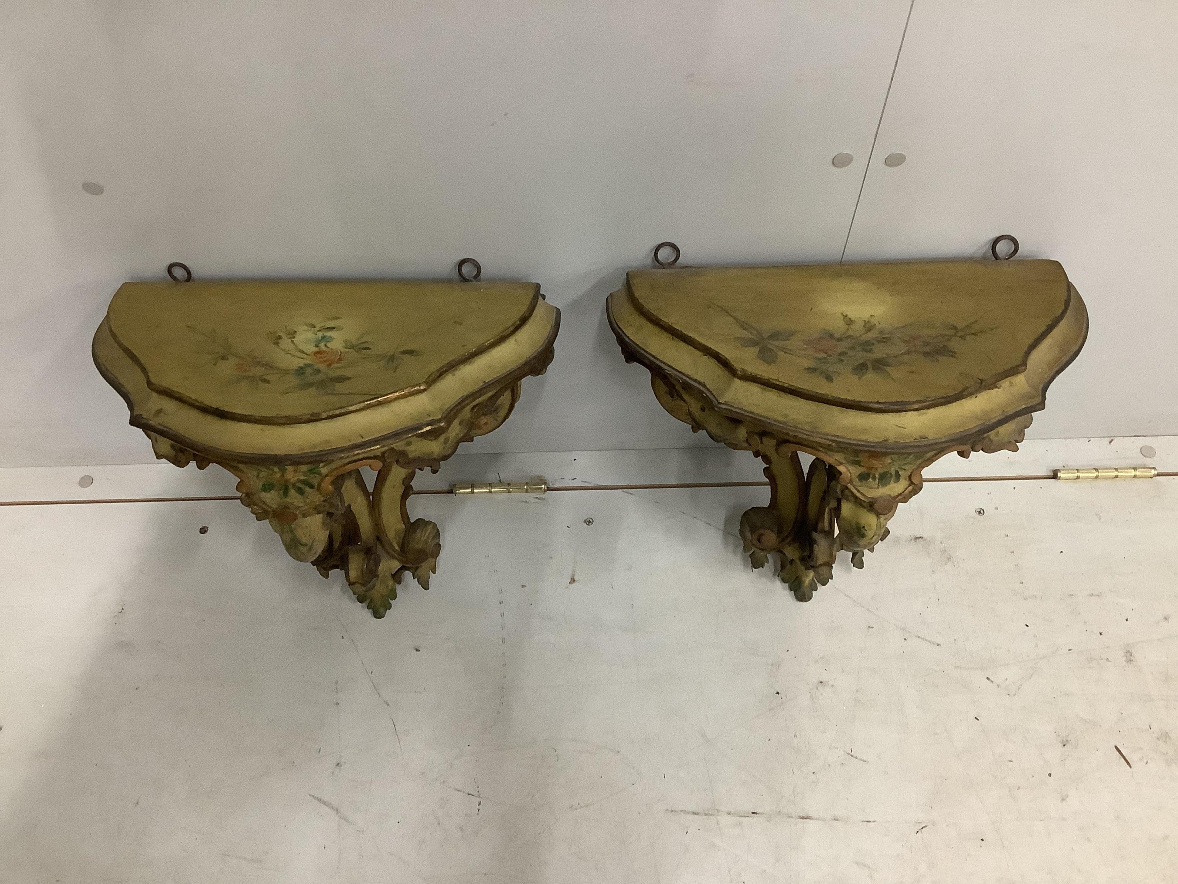 A pair of 18th century style Italian carved and painted pine wall brackets, width 38cm, depth 26cm, height 38cm. Condition - fair